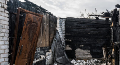 900 burnt out dwelling with charred walls and destruction